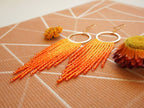Orange Fringe Hoop Earrings: Handwoven Statement Jewelry
