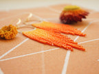 Orange Fringe Hoop Earrings: Handwoven Statement Jewelry